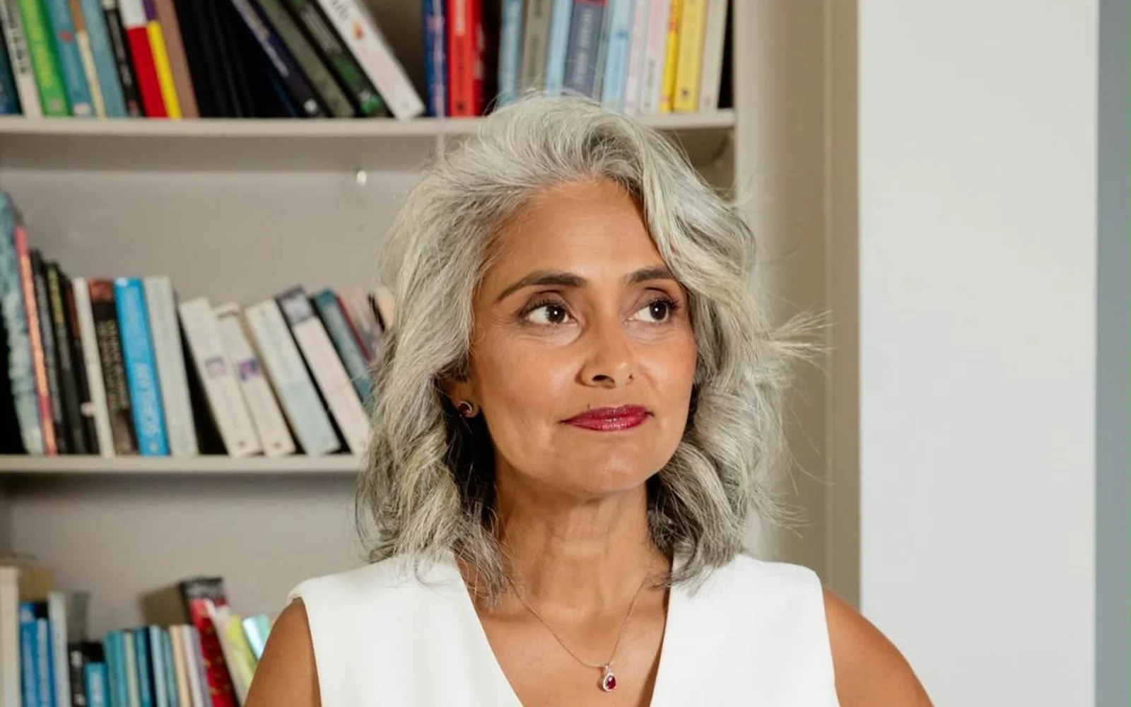Dimple Amore by her bookshelf, Why Rest Feels Unsafe When You’ve Built Everything in The Journal